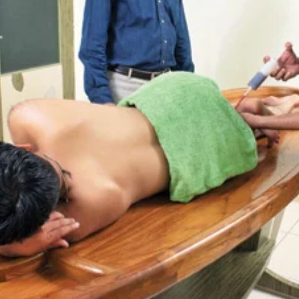 Basti treatment in Ayurveda showing medicated fluid moving through the colon