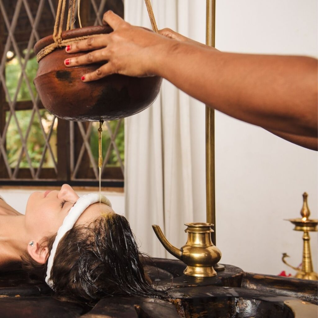 Shirodhara Ayurvedic treatment using warm herbal oil on the forehead