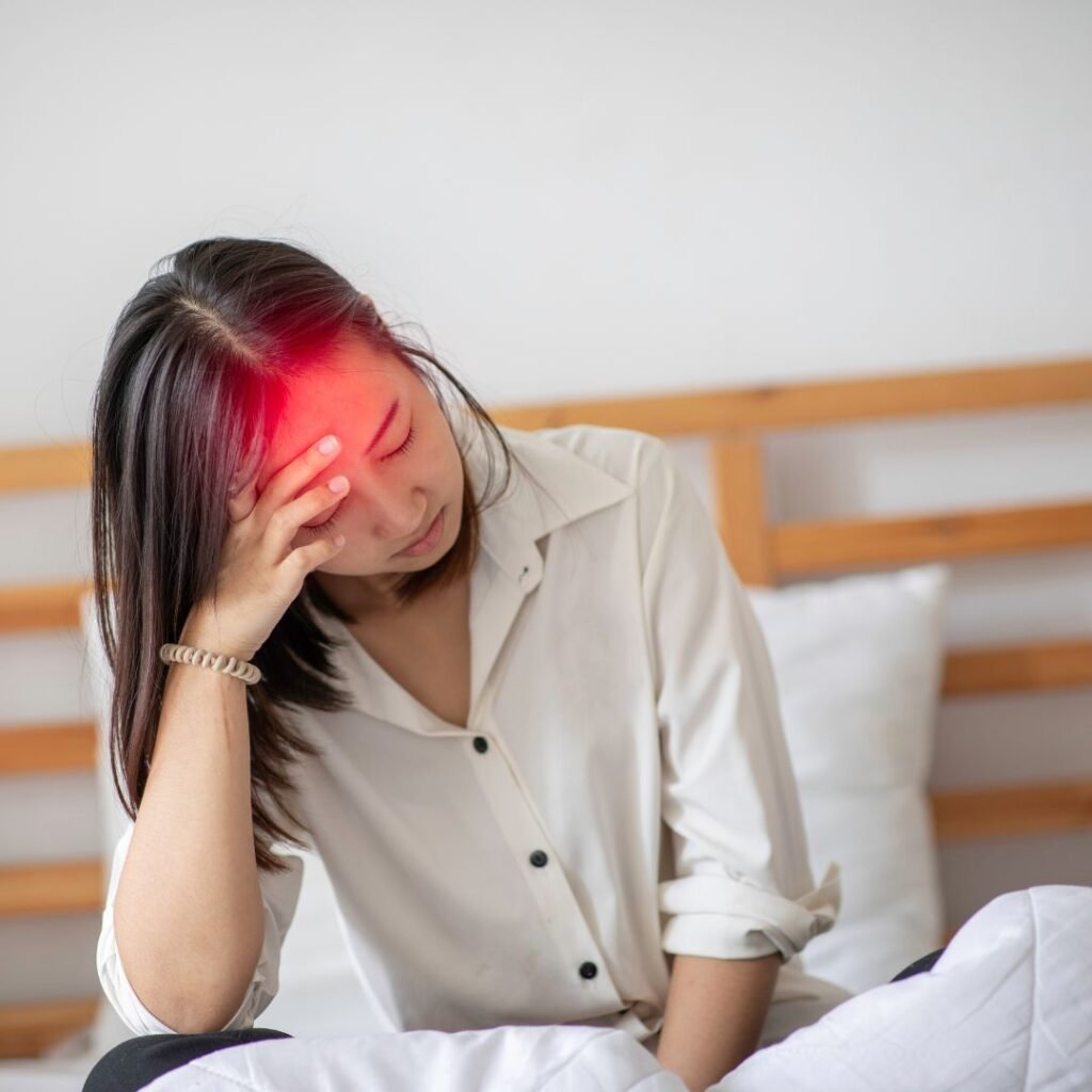 Woman experiencing migraine headache